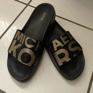 Michael Kors Gilmore slides black and gold good condition